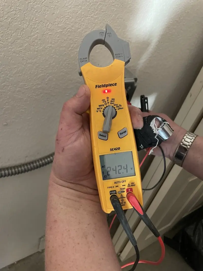 Voltage testing with clamp meter during Circuit Breaker Repair in Acton